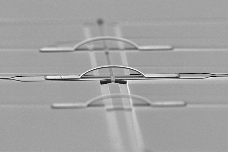 Scanning electron microscope images of devices fabricated by Dr. Byeon. Suspended aluminum airbridge structures. The airbridges provide electrical connection between on-chip electrodes that might be separated by structures such as a helium microchannel or another electrode, as shown here.